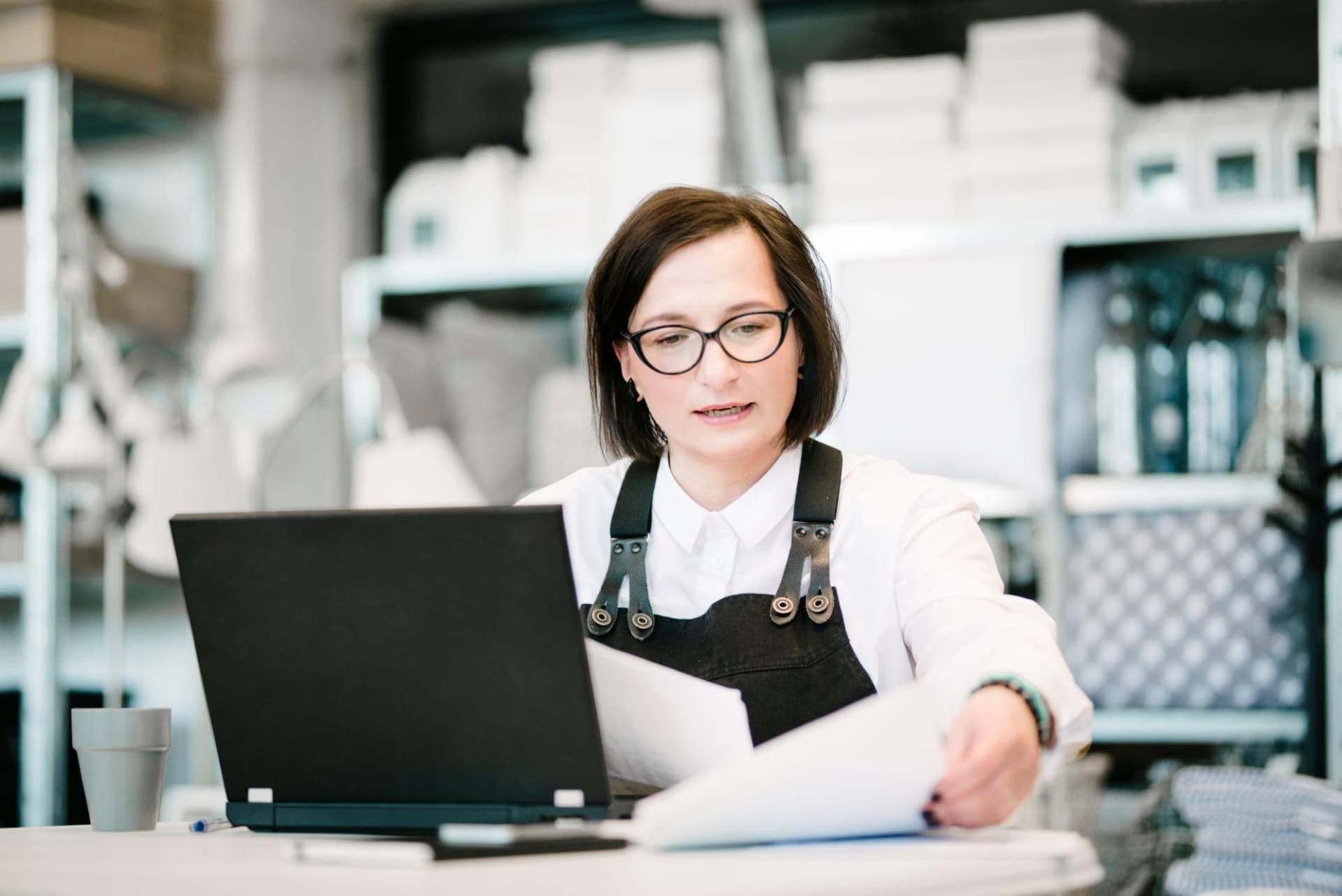 Professional reviewing a document at a desk